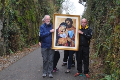 Gerard Enright and Tom Moroney pause on their journey from Durrow to Abbeyside along the Greenway carrying the the Icon of the Holy Family and prepare to lead the procession from the Ballinroad Greenway car-park to Abbeyside Church. (Tom Keith)